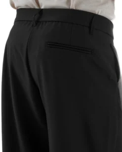 Pantaloni uomo viscosa baggy abbottonatura asimmetrica nero GIOSAL-P6465A
